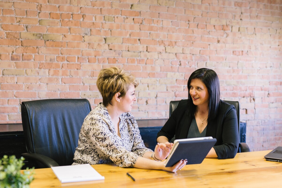 two women discussing Occupational Health and Safety Concerns