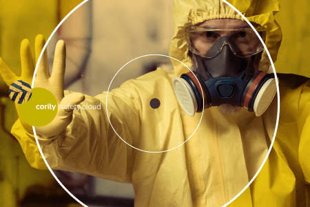 Person in a yellow hazmat suit and gas mask holding up a gloved hand, warning of the risk of serious injury or fatality, with a safety cloud graphic overlay.