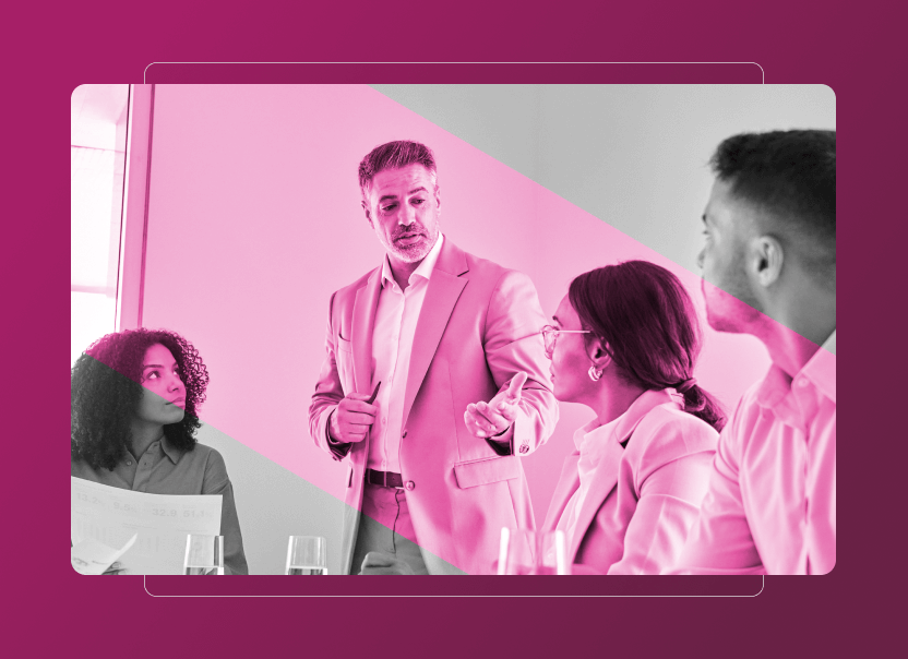 A group of four people in business attire are having a meeting; one man stands and speaks about Sustainability Cloud while the others sit at a table listening. The image has a pink overlay and a modern graphic border.