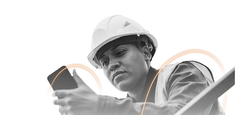 A person wearing a hard hat and safety vest looks intently at a smartphone, appearing focused and engaged, as an EHS AI-powered light arc graphic glows in the background.